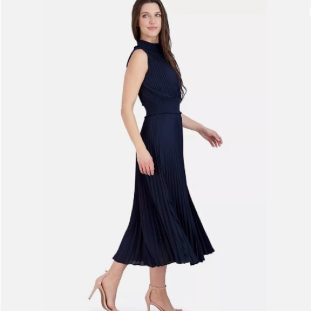 Fabulous LBD blouson dress featuring a smocked waist & accordion pleats